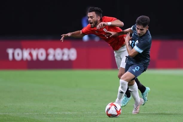 Salah Mohsen of Team Egypt is challenged by Claudio Bravo of Team Argentina during the Men's First Round Group C match between Egypt and Argentina on...