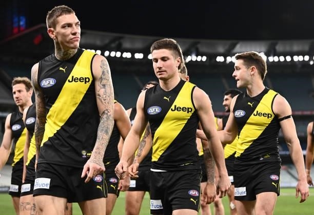 Matthew Parker and his Tigers team mates look dejected after losing the round 19 AFL match between Geelong Cats and Richmond Tigers at Melbourne...
