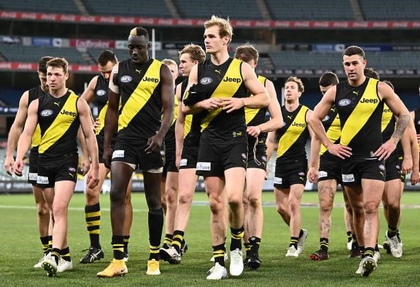 The Tigers look dejected after losing the round 19 AFL match between Geelong Cats and Richmond Tigers at Melbourne Cricket Ground on July 25, 2021 in...