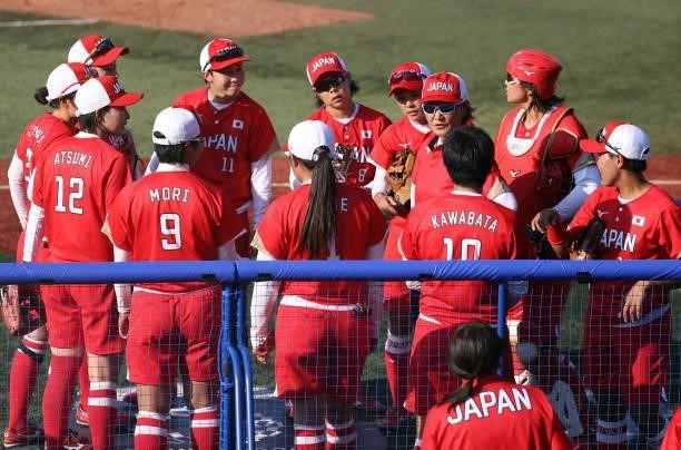 Head coach Reika Utsugi of Team Japan talks to her team in the middle of the eighth inning of the game against Team Canada during the Softball...