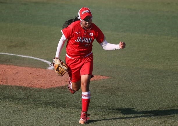 Pitcher Miu Goto of Team Japan pumps her fist after getting out of the top of the eighth inning against Team Canada during the Softball Opening Round...