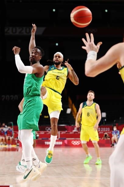 Patty Mills of Team Australia passes the ball against Nigeria in the first half on day two of the Tokyo 2020 Olympic Games at Saitama Super Arena on...