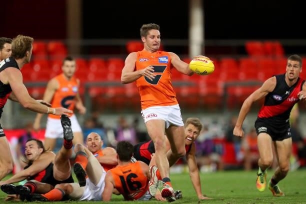 Jesse Hogan of the GWS Giants kicks a goal during the round 19 AFL match between Essendon Bombers and Greater Western Sydney Giants at Metricon...