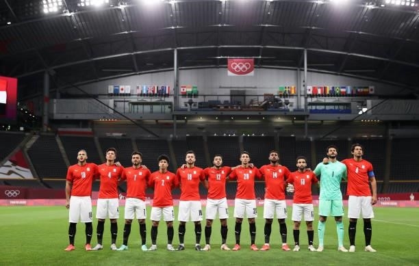 Players of Team Egypt stand for the national anthem prior to the Men's First Round Group C match between Egypt and Argentina on day two of the Tokyo...