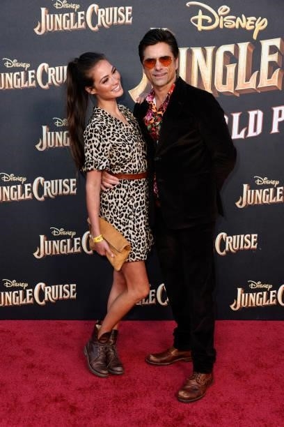 John Stamos and Caitlin McHugh attend Disney's "Jungle Cruise