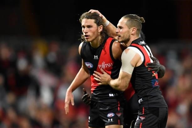 David Zaharakis of the Bombers celebrates with team mates after kicking a goal during the round 19 AFL match between Essendon Bombers and Greater...