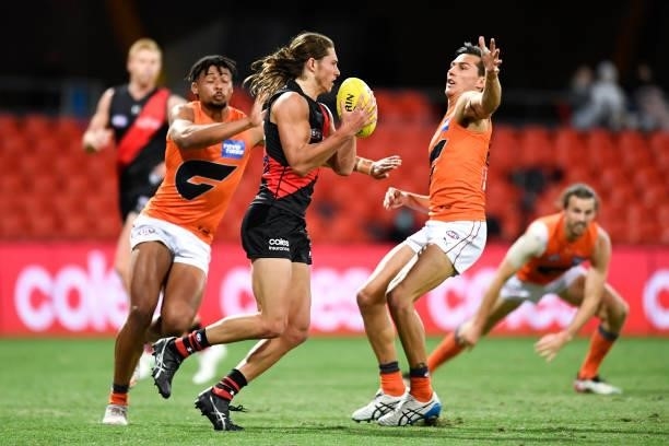 Archie Perkins of the Bombers in action during the round 19 AFL match between Essendon Bombers and Greater Western Sydney Giants at Metricon Stadium...