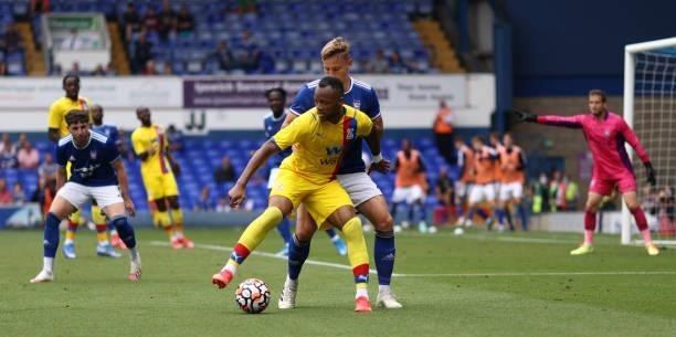 Jordan Ayew of Crystal Palace and Luke Woolfenden of Ipswich Town battle for the ball during the pre-season friendly match between Ipswich Town and...