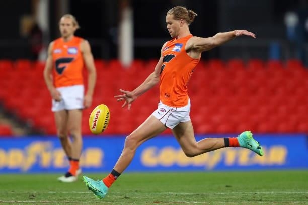 Harry Himmelberg of the GWS Giants kicks the ball during the round 19 AFL match between Essendon Bombers and Greater Western Sydney Giants at...