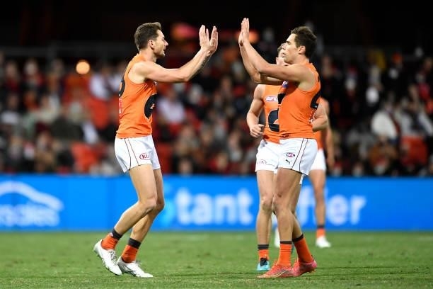 Daniel Lloyd of the Giants celebrates kicking a goal during the round 19 AFL match between Essendon Bombers and Greater Western Sydney Giants at...