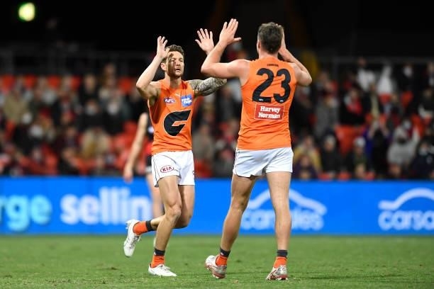 Daniel Lloyd of the Giants celebrates kicking a goal during the round 19 AFL match between Essendon Bombers and Greater Western Sydney Giants at...
