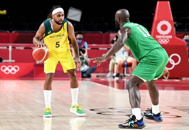 Patty Mills of Australia looks to takes on the defence during the preliminary rounds of the Men's Basketball match between Australia and Nigeria on...