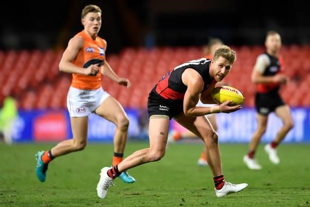 Dyson Heppell of the Bombers in action during the round 19 AFL match between Essendon Bombers and Greater Western Sydney Giants at Metricon Stadium...