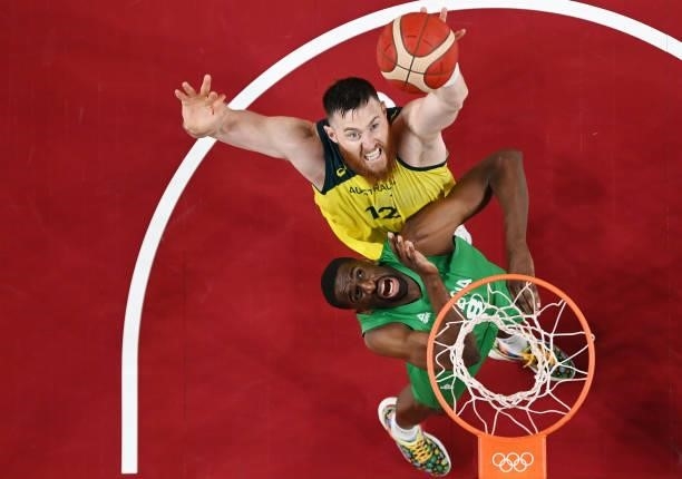 Aron Baynes of Team Australia and Ekpe Udoh of Team Nigeria battle for possession of a rebound in the first half of their Men's Preliminary Round...