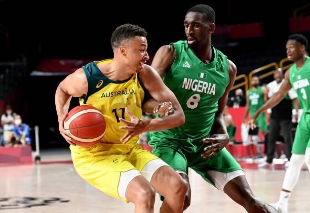Dante Exum of Australia attempts to break away from the defence of Ekpe Udoh of Nigeria during the preliminary rounds of the Men's Basketball match...
