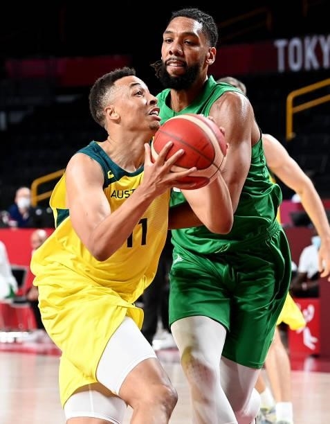 Dante Exum of Australia breaks away from the defence of Jahlil Okafor of Nigeria during the preliminary rounds of the Men's Basketball match between...