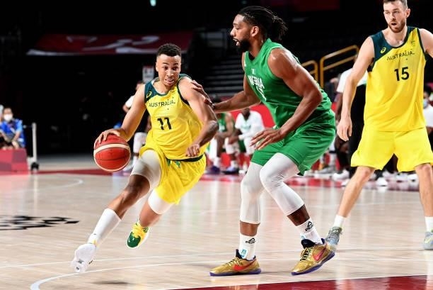 Dante Exum of Australia takes on the defence of Jahlil Okafor of Nigeria during the preliminary rounds of the Men's Basketball match between...