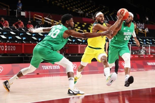 Patty Mills of Team Australia drives to the basket against Nigeria during the first Men's Preliminary Round Group B game on day two of the Tokyo 2020...