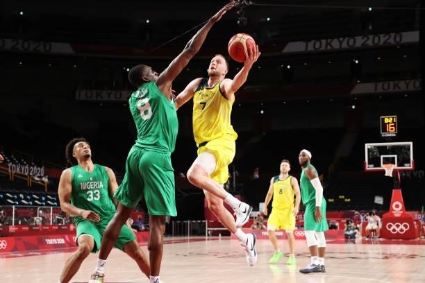 Joe Ingles of Team Australia drives to the basket against Ekpe Udoh of Team Nigeria in the first half of the Men's Preliminary Round Group B game on...