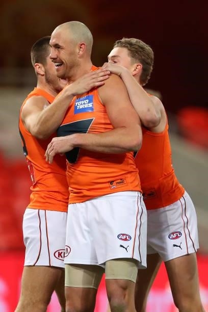 Shane Mumford of the GWS Giants celebrates his goal during the round 19 AFL match between Essendon Bombers and Greater Western Sydney Giants at...