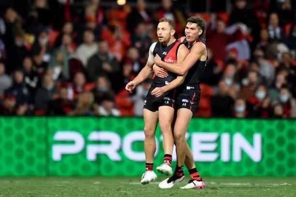 Devon Smith of the Bombers watches on after kicking for goal during the round 19 AFL match between Essendon Bombers and Greater Western Sydney Giants...