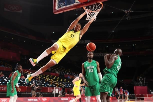 Dante Exum of Team Australia dunks against Team Nigeria during the first half of the Men's Preliminary Round Group B game on day two of the Tokyo...