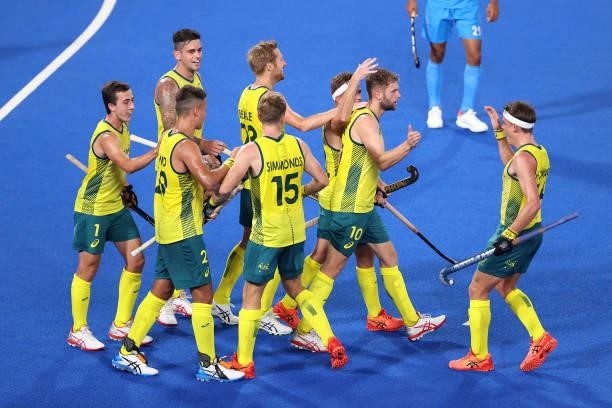 Joshua Beltz of Team Australia celebrates with teammates after scoring their team's fourth goal during the Men's Preliminary Pool A match between...