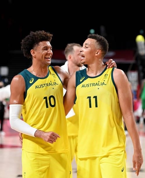 Matisse Thybulle and Dante Exum of Australia celebrate victory after the preliminary rounds of the Men's Basketball match between Australia and...