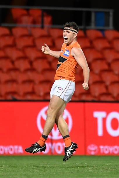 Brent Daniels of the Giants celebrates kicking a goal during the round 19 AFL match between Essendon Bombers and Greater Western Sydney Giants at...