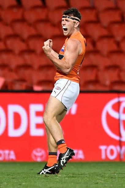 Brent Daniels of the Giants celebrates kicking a goal during the round 19 AFL match between Essendon Bombers and Greater Western Sydney Giants at...