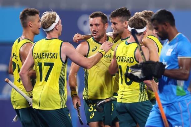 Blake Govers of Team Australia celebrates with teammates after scoring their team's sixth goal during the Men's Preliminary Pool A match between...