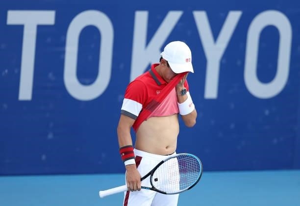 Kei Nishikori of Team Japan reacts after a point during his Men's Singles First Round match against Andrey Rublev of Team ROC on day two of the Tokyo...