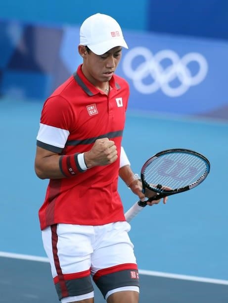 Kei Nishikori of Team Japan celebrates after a point during his Men's Singles First Round match against Andrey Rublev of Team ROC on day two of the...