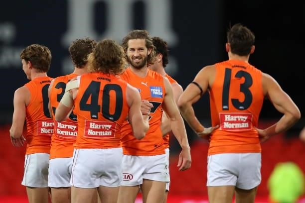 Callan Ward of the GWS Giants celebrates the win during the round 19 AFL match between Essendon Bombers and Greater Western Sydney Giants at Metricon...
