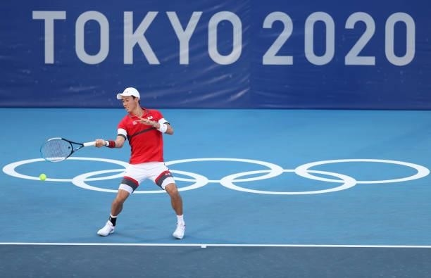 Kei Nishikori of Team Japan plays a forehand during his Men's Singles First Round match against Andrey Rublev of Team ROC on day two of the Tokyo...