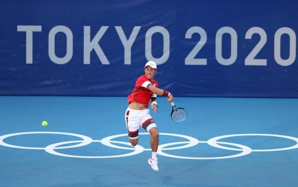 Kei Nishikori of Team Japan plays a forehand during his Men's Singles First Round match against Andrey Rublev of Team ROC on day two of the Tokyo...