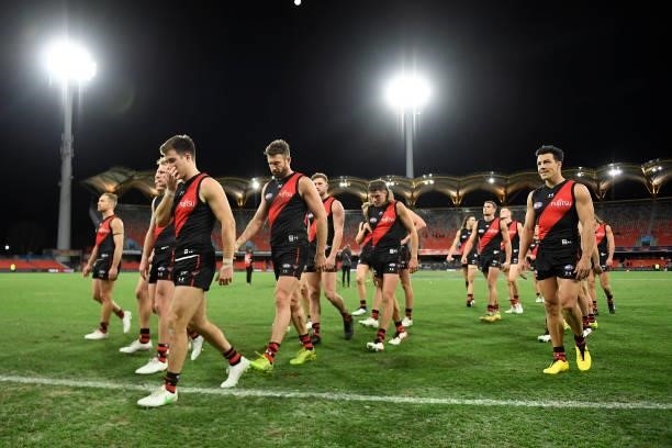 Essendon Bombers walk off the field after their defeat during the round 19 AFL match between Essendon Bombers and Greater Western Sydney Giants at...