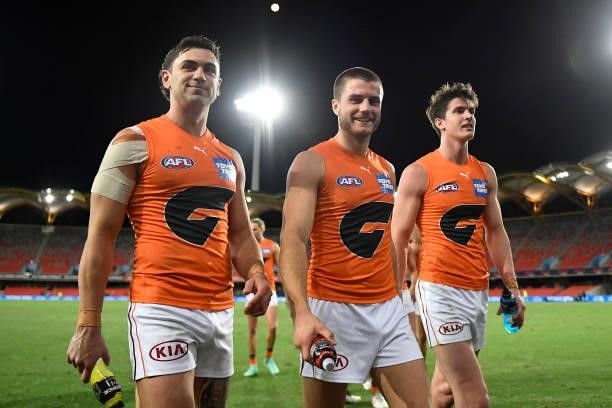 Giants walk off the field after their victory during the round 19 AFL match between Essendon Bombers and Greater Western Sydney Giants at Metricon...