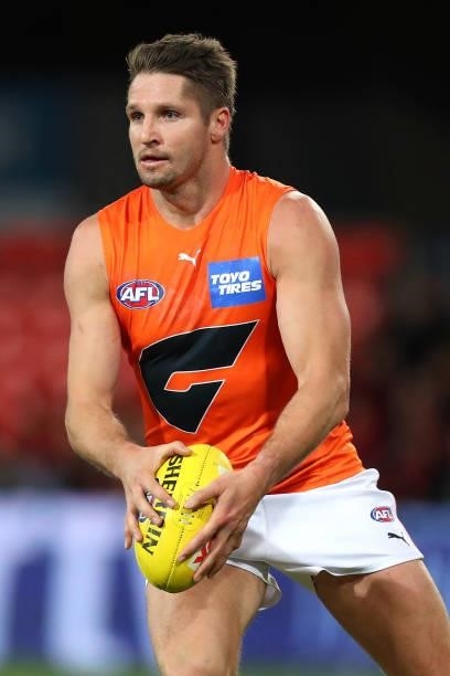 Jesse Hogan of the GWS Giants runs with the ball during the round 19 AFL match between Essendon Bombers and Greater Western Sydney Giants at Metricon...