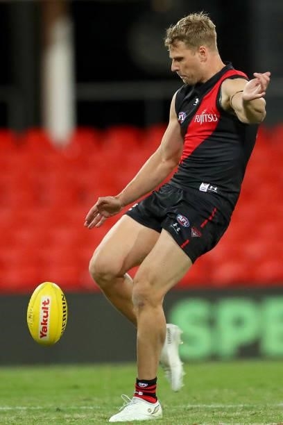 Jake Stringer of Essendon kicks the ball during the round 19 AFL match between Essendon Bombers and Greater Western Sydney Giants at Metricon Stadium...