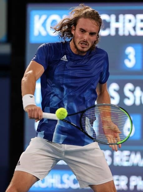 Stefanos Tsitsipas of Team Greece plays a backhand during his Men's Singles First Round match against Philipp Kohlschreiber of Team Germany on day...
