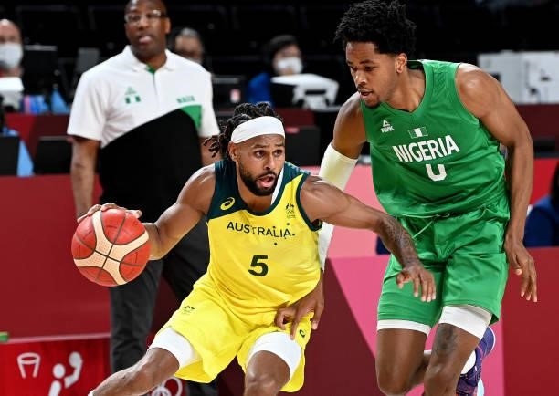 Patty Mills of Australia breaks away from the defence of Chikezie Okpala of Nigeria during the preliminary rounds of the Men's Basketball match...