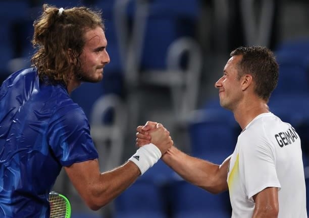 Stefanos Tsitsipas of Team Greece shakes hands with his opponent Philipp Kohlschreiber of Team Germany after their Men's Singles First Round match...