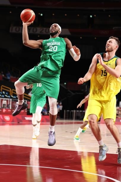 Josh Okogie of Team Nigeria drives past Nic Kay of Team Australia during the second half of the Men's Preliminary Round Group B game on day two of...