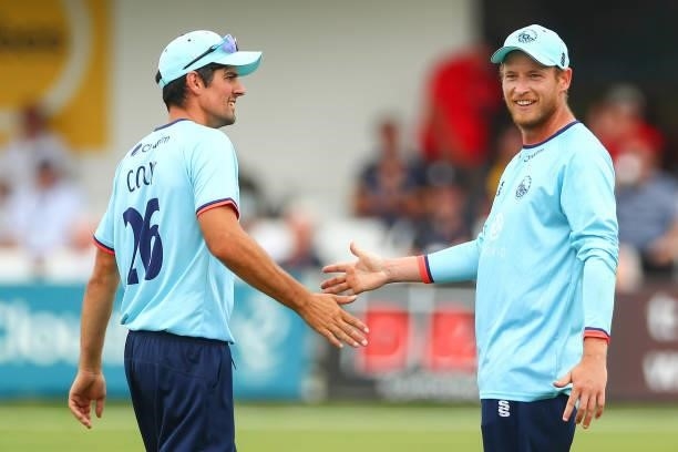 Tom Westley of Essex celebrates with Alastair Cook of Essex after catching out Max Holden of Middlesex during the Royal London Cup match between...