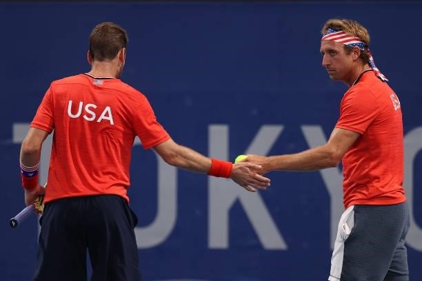 Tennys Sandgren of Team USA and Austin Krajicek of Team USA during their Men's Doubles First Round match against John Peers of Team Australia and Max...