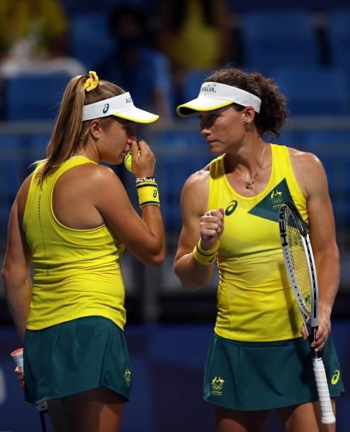 Samantha Stosur of Team Australia and Ellen Perez of Team Australia during their Women's Doubles First Round match against Anastasija Sevastova of...