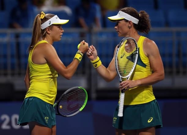 Samantha Stosur of Team Australia and Ellen Perez of Team Australia during their Women's Doubles First Round match against Anastasija Sevastova of...