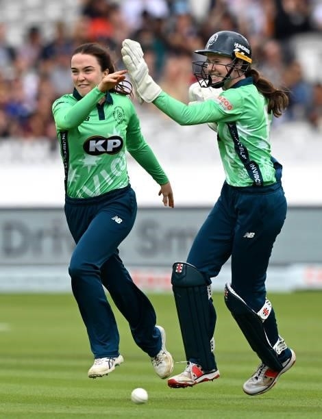 Mady Villiers of Oval Invincibles celebrates with wicket keeper Sarah Bryce during The Hundred match between London Spirit Women and Oval Invincibles...