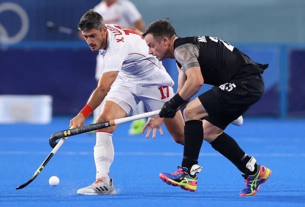 Xavier Lleonart Blanco of Team Spain and Shea McAleese of Team New Zealand battle for the ball during the Men's Preliminary Pool A match between...